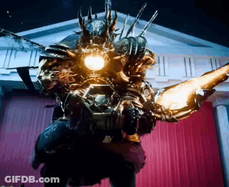A Monster Is Standing In Front Of A Building With A Red Curtain And A Light On It 'S Head . GIF