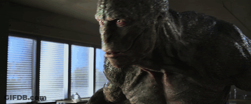 A Monster Standing In Front Of A Window With Blinds On It GIF