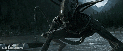A Monster With A Long Tail Is Standing In The Dark Near A Body Of Water GIF