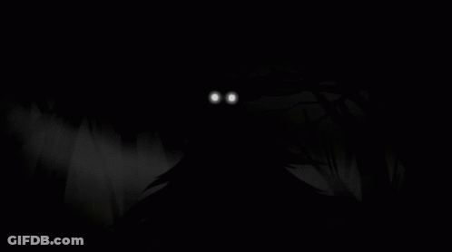 A Monster With Glowing Eyes Is Coming Out Of The Woods In The Dark . GIF
