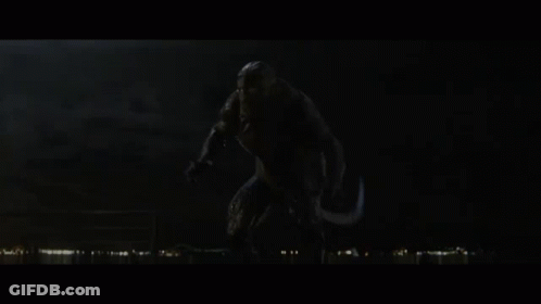 A Monster With Its Mouth Open In The Dark GIF