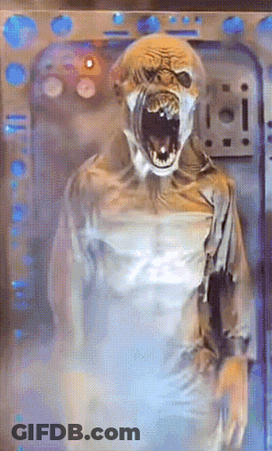 A Monster With Its Mouth Open Is Standing In Front Of A Door That Says ' I ' On It GIF