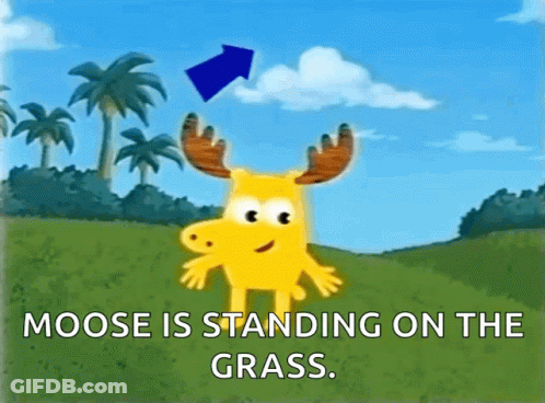 A Moose Is Standing On The Grass With A Blue Arrow Pointing To It GIF