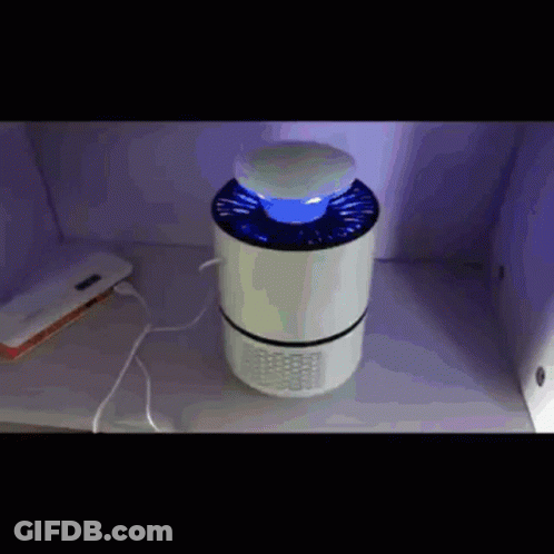 A Mosquito Killer Is Sitting On A Table Next To A Charger GIF