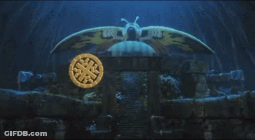 A Mothra Logo With A Moth On Top Of It GIF