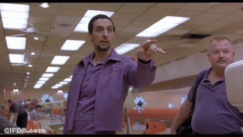A Movie Clip From Movieclips.com Shows A Man In A Purple Shirt Pointing At Something GIF