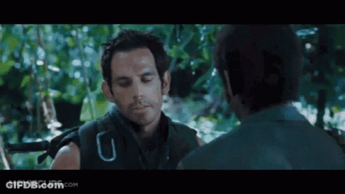 A Movie Clip From Movieclips.com Shows Two Men Talking In The Jungle GIF