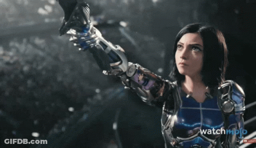 A Movie Poster For " Alita : Battle Angel " Shows A Woman Holding A Sword GIF