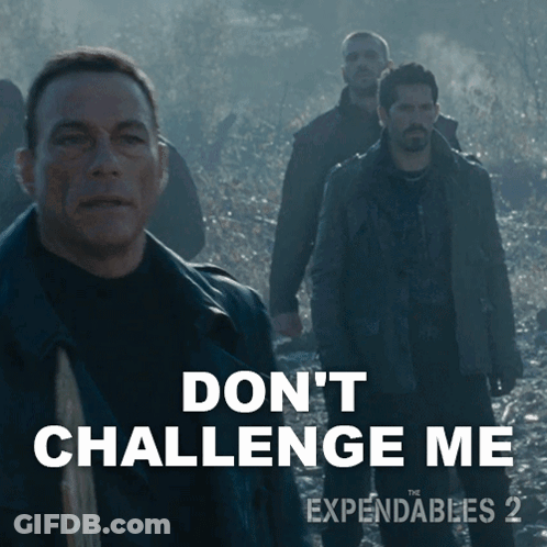 A Movie Poster For Expendables 2 Shows A Man Holding A Gun GIF