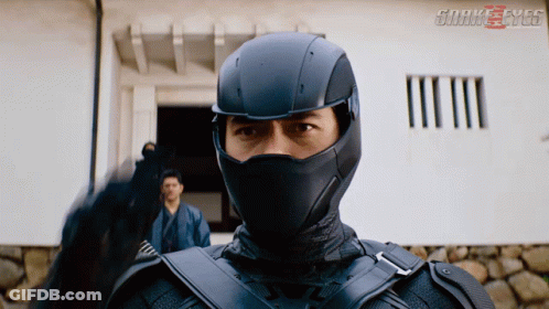 A Movie Poster For Snake Eyes Shows A Man In A Mask GIF