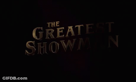 A Movie Poster For The Greatest Showman With A Black Background GIF