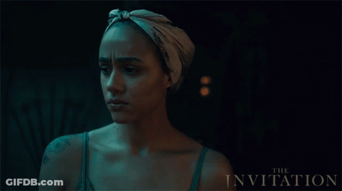 A Movie Poster For The Invitation Features A Woman Wearing A Scarf Around Her Head GIF