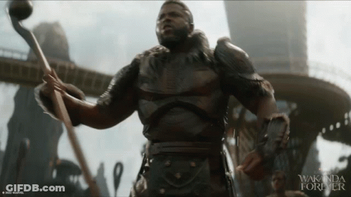 A Movie Poster For Wakanda Forever With A Man In Armor GIF