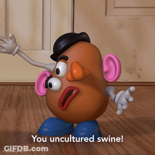 A Mr Potato Head Says " You Uncultured Swine " On A Wooden Floor GIF