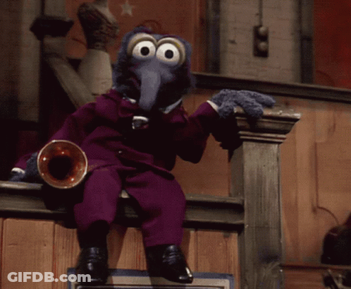 A Muppet In A Purple Suit Sits On A Railing Playing A Trumpet GIF