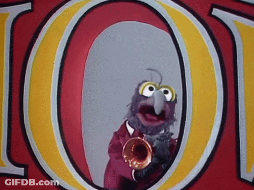 A Muppet Is Playing A Trumpet In Front Of A Sign That Says Loot GIF