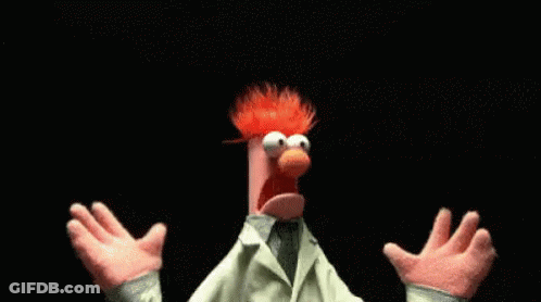 A Muppet With Red Hair And A White Coat Is Standing With His Arms Outstretched . GIF