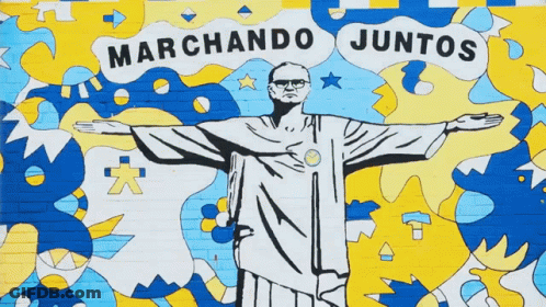 A Mural Of Jesus With The Words Marchando Juntos Above GIF