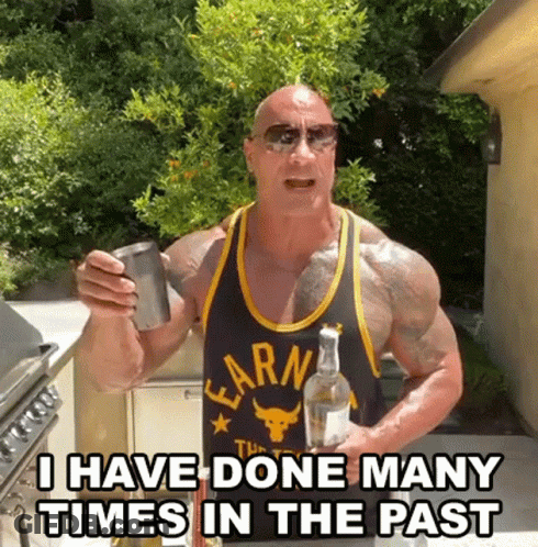 A Muscular Man In A Tank Top Is Holding A Bottle Of Alcohol And A Cup . GIF