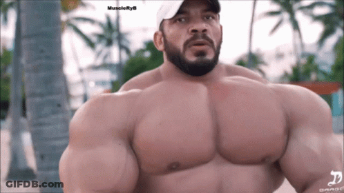 A Muscular Man With A Beard Wearing A White Hat With The Word Muscleryb On The Bottom GIF
