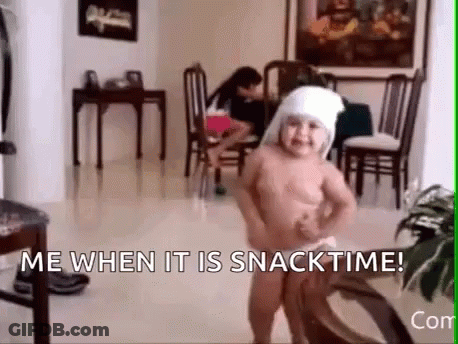 A Naked Baby Is Dancing In A Living Room With The Words `` Me When It Is Snacktime '' . GIF