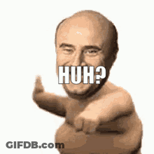 A Naked Man Is Pointing At The Camera With The Word Huh Written On His Face . GIF
