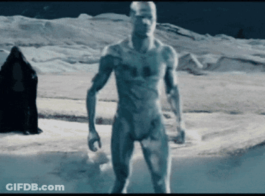 A Naked Man Standing In A Snowy Field GIF