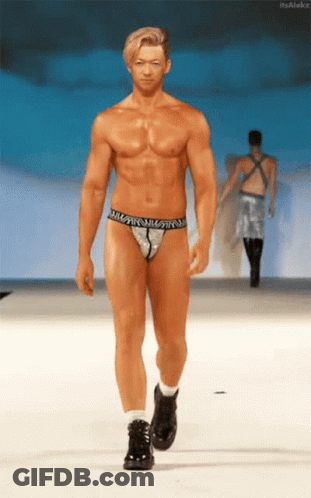 A Naked Man Walks Down A Runway Wearing A Thong That Says ' William ' On It GIF