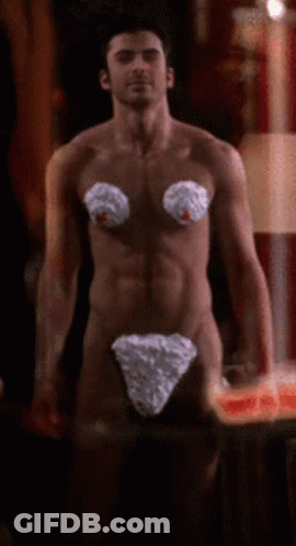 A Naked Man With Whipped Cream On His Breasts GIF