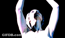 A Naked Person With Their Arms Outstretched And Their Mouth Open GIF