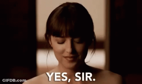 A Naked Woman Says Yes Sir In A Dark Room . GIF