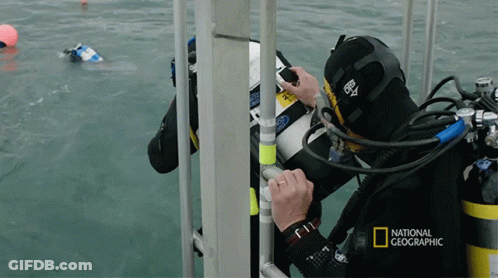 A National Geographic Advertisement With A Scuba Diver On It GIF