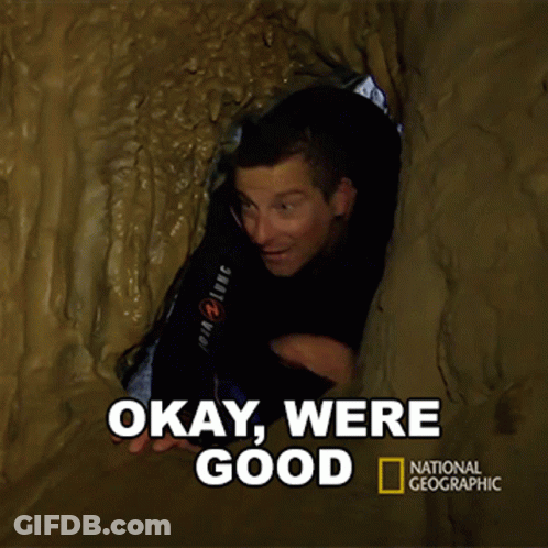 A National Geographic Poster With A Man In A Cave GIF