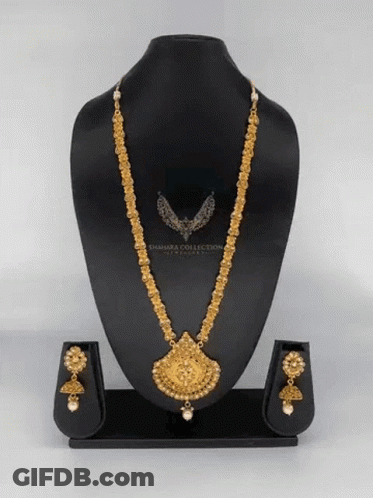 A Necklace And Earring Set Is On A Mannequin With The Word Sahara Collection On It GIF