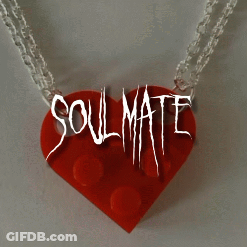 A Necklace With A Red Heart And The Words Soulmate GIF