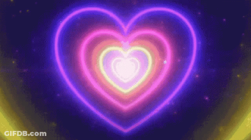 A Neon Heart Is Glowing In The Dark On A Dark Background GIF