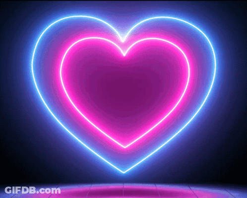 A Neon Heart Is Glowing In The Dark On A Dark Background GIF