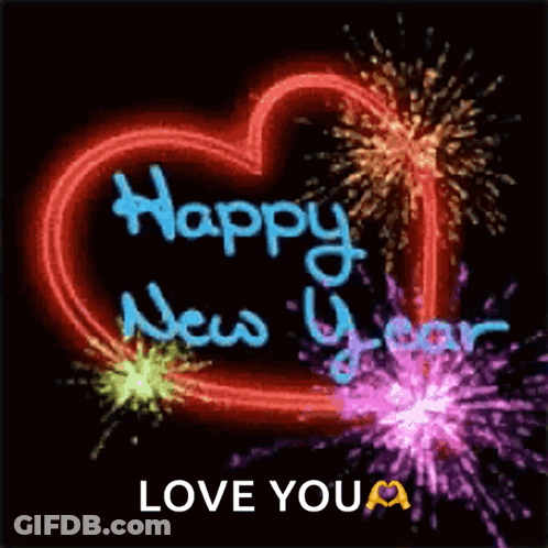 A Neon Heart With The Words Happy New Year Love You Written On It GIF