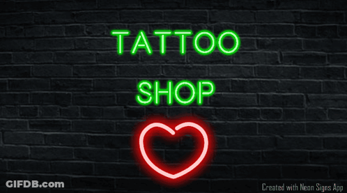 A Neon Sign For A Tattoo Shop With A Heart GIF