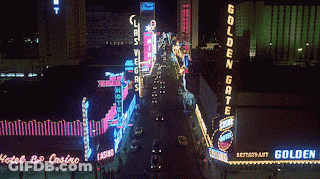 A Neon Sign For The Golden Gate Restaurant Is Lit Up GIF