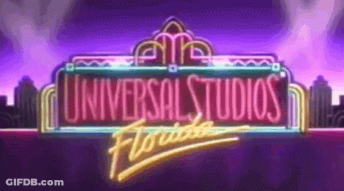 A Neon Sign For Universal Studios Florida With A Purple Background GIF