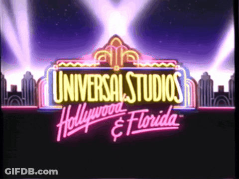 A Neon Sign For Universal Studios Hollywood And Florida Is Lit Up GIF