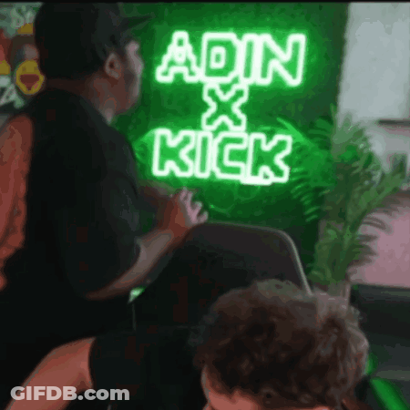 A Neon Sign That Says Ain X Kick Is Lit Up GIF