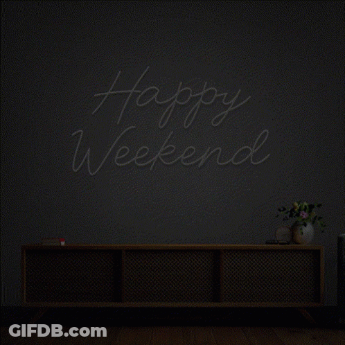 A Neon Sign That Says Happy Weekend Is Lit Up In A Dark Room GIF