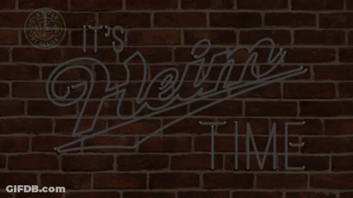 A Neon Sign That Says " It 'S Heinz Time " On A Brick Wall GIF