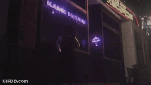 A Neon Sign That Says Kame House With An Umbrella On It GIF