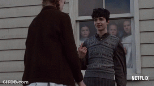 A Netflix Ad Shows A Boy And A Woman Holding Hands GIF