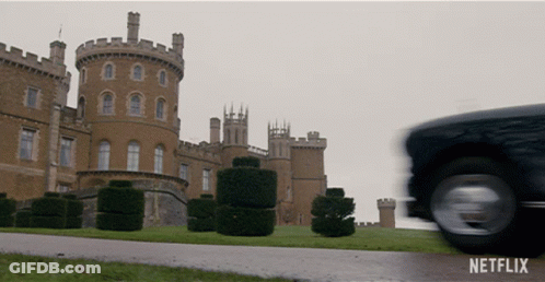 A Netflix Ad Shows A Castle And A Car Driving By GIF