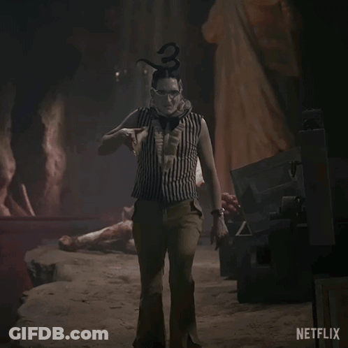 A Netflix Ad Shows A Clown Holding A Large Sword GIF