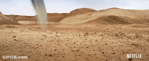 A Netflix Ad Shows A Desert With A Tornado In The Background GIF